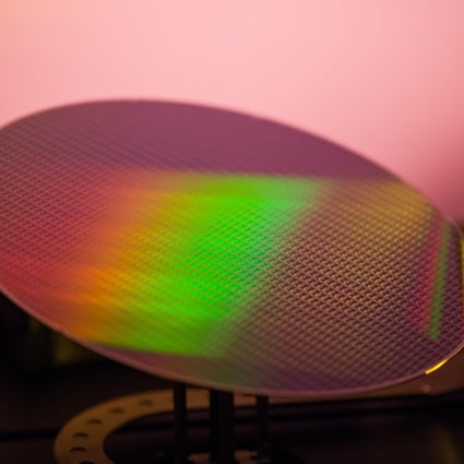 A 200 millimetre silicon wafer in a lithography scanner during manufacture at the X-Fab Silicon Foundries SE semiconductor plant in Corbeil-Essonnes, France, on June 1. Thinner wafers with stacked integrated circuits could be key to unlocking next-generation chip technology. Photo: Bloomberg