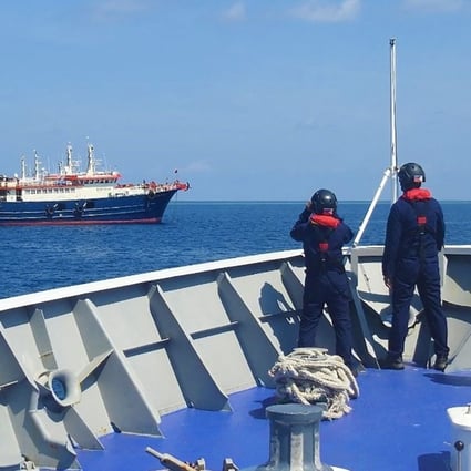 Philippine coastguard personnel aboard the BRP Cabra monitor Chinese vessels anchored at Sabina Shoal, a South China Sea outcrop claimed by both Manila and Beijing. Photo: AFP
