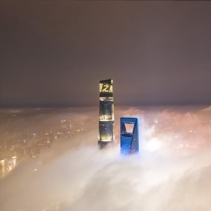 Tips of the Shanghai Tower (left) and the Shanghai World Financial Centre peek above the fog cover in June 2020. Photo: VCG