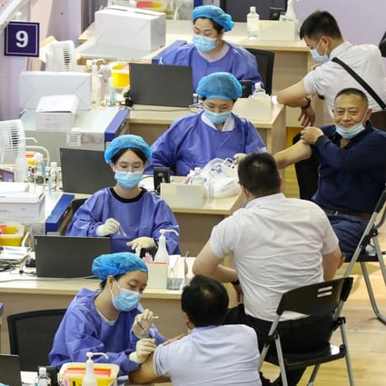 People get vaccinated in Nantong, Jiangsu province last week. China wants 70 per cent of the population immunised by the end of the year. Photo: AFP