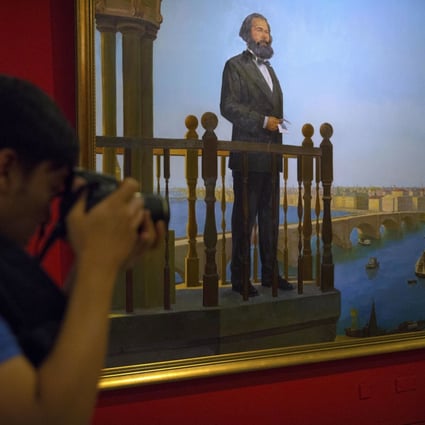 Visitors look at paintings at an exhibition to commemorate the 200th anniversary of the birth of Karl Marx at the National Museum in Beijing on May 5, 2018. An opinion piece published by the CPPCC Daily refers to Marx’s ideals, so that China’s Big Tech companies’ can end their gruelling 996 work culture. Photo: AP