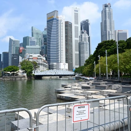 A public area on the Singapore River is temporarily closed. The city state has tightened its coronavirus restrictions as it tries to control a growing karaoke cluster. Photo: AFP