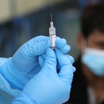 A medical worker prepares a coronavirus vaccine shot. More than 14 million doses have been administered in Malaysia since February, with 14 per cent of the population now fully vaccinated. Photo: Reuters