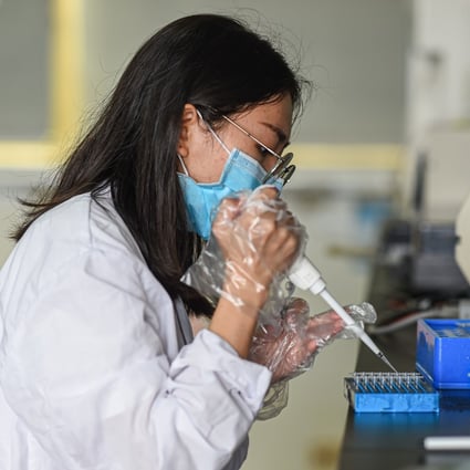 A researcher works at a laboratory of Coconut Research Institute, Chinese Academy of Tropical Agricultural Sciences, in Wenchang, south China's Hainan Province, March 11, 2021. Photo: Xinhua