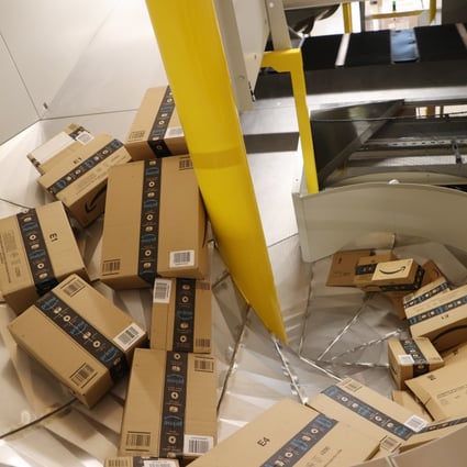 Amazon shipping boxes lie on conveyor belts during a trial run at the logistics hall of the new Amazon logistics centre in Gera, Germany, on July 21. Chinese cross-border e-commerce merchants are facing “growing pains”, a Beijing official said on Thursday, after Amazon banned some of the biggest sellers from its platform. Photo: dpa