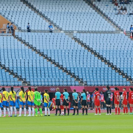 Brazil and China players line up for their Olympic women’s football match before near-empty stands on Wednesday in Miyagi. Photo: AFP
