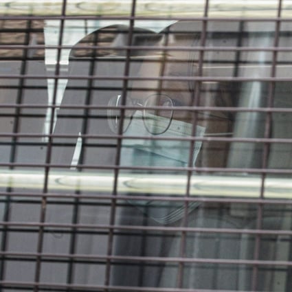 General Union of Hong Kong Speech Therapists chairwoman Lai Man-ling is seen in a police van outside West Kowloon Court. Photo: Handout