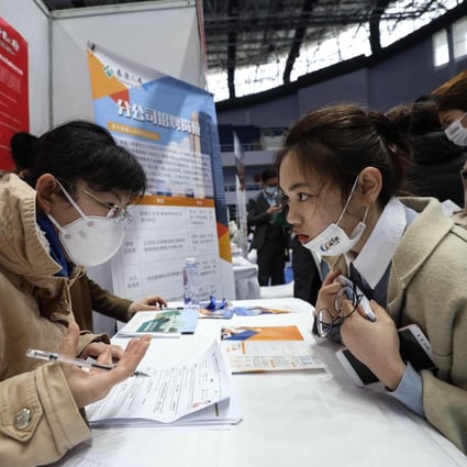 A jobseeker (right) being interviewed at a career fair in Wuhan, in China's central Hubei province, on March 10. China’s tech giants are looking to hire thousands of new graduates this year and next amid increasing political pressure on the industry. Photo: AFP