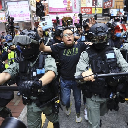 People Power activist Tam Tak-chi (centre) near the Sogo department store in Causeway Bay on May 24 last year. Photo: May Tse
