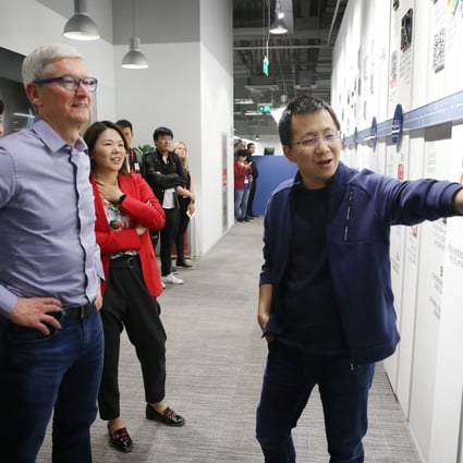 ByteDance founder Zhang Yiming shows Apple chief executive Tim Cook around the TikTok operator’s Beijing headquarters during a meeting on October 11, 2018. Photo: ImagineChina