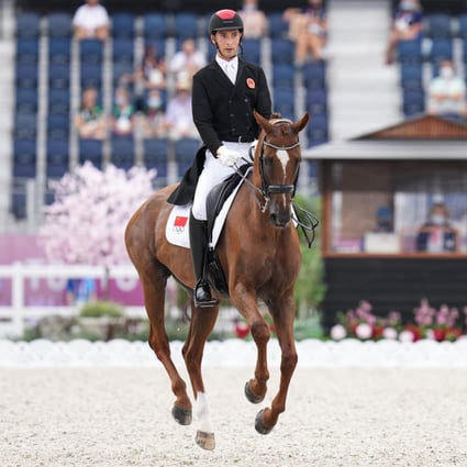 Chinese rider Alex Hua Tian and Don Geniro perform during the dressage part of the eventing competition at the Olympic Games. Photo: Xinhua
