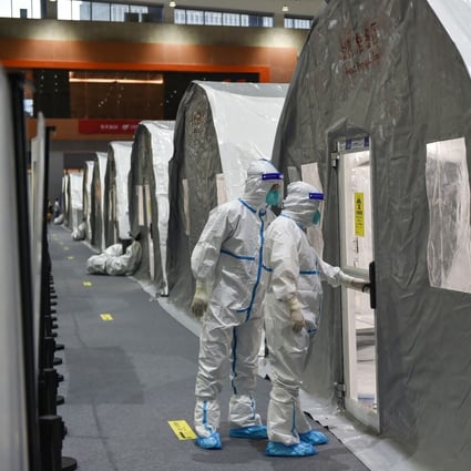 Checks are made at a temporary laboratory used for Covid-19 testing in Nanjing, Jiangsu province. A cluster at the airport is believed to have led to cases elsewhere in Nanjing as well as in other Chinese cities. Photo: AFP