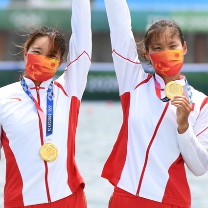 China’s women’s quadruple sculls team of Chen Yunxia, Zhang Ling, Lyu Yang and Cui Xiaotong celebrate with their gold medals. Photo: Reuters