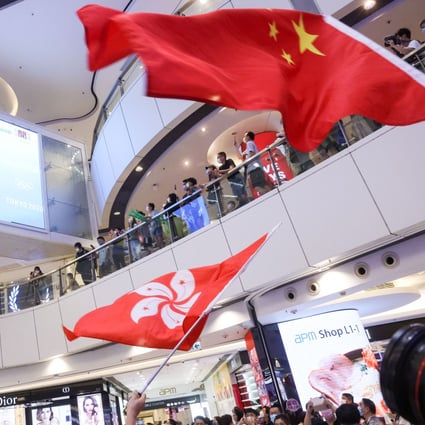 Hongkongers flock to APM shopping centre to watch a live screening of local swimmer Siobhan Haughey winning silver at the Tokyo Olympics. Photo: K. Y. Cheng