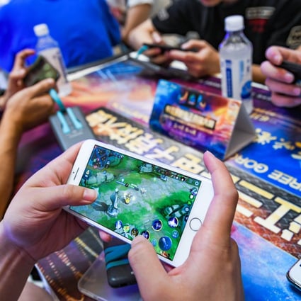 Players competing in a match of Tencent's mobile game honour of Kings during the 3rd Yangtze River Three Gorges esports Games (TGEG) in Chongqing on 14 July 2019. Photo: Imaginechina