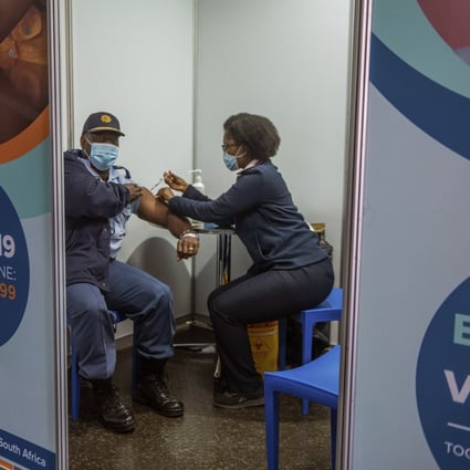 A police officer receives a Johnson & Johnson Covid-19 vaccine in Soweto, South Africa. There has been a rapid rise in infections across the continent, and experts say the surge here has not yet peaked. Photo: AP Photo