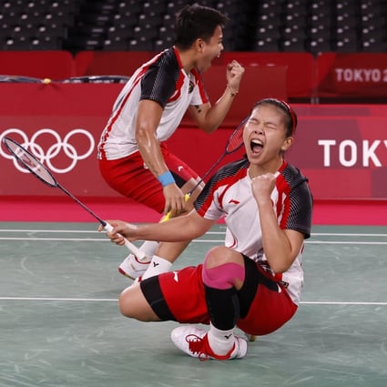 Apriyani Rahayu and Greysia Polii celebrate winning the badminton women’s doubles gold medal match between Indonesia and China at the Tokyo 2020 Olympic Games. Photo: EPA