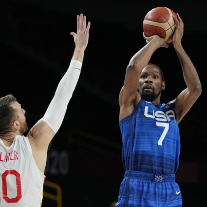 Kevin Durant shoots over Spain’s Victor Claver as the USA advances to the semi-finals at the Olympic Games. Photo: AP