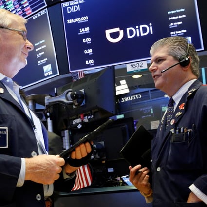 Traders are seen at work during the initial public offering of Chinese ride-hailing company Didi Global on the New York Stock Exchange floor on June 30, 2021. Photo: Reuters