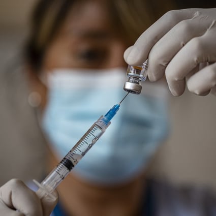 A health worker prepares a dose of Sinovac’s Covid-19 vaccine in Santiago, Chile. Photo: AP