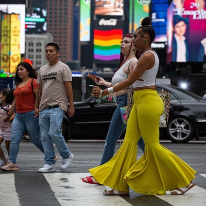 Unmasked people walked through the street in Midtown Manhattan in New York in July 2021. A report by three Chinese think tanks accuses the US of being the country with the worst pandemic management record in the world. Photo: AFP