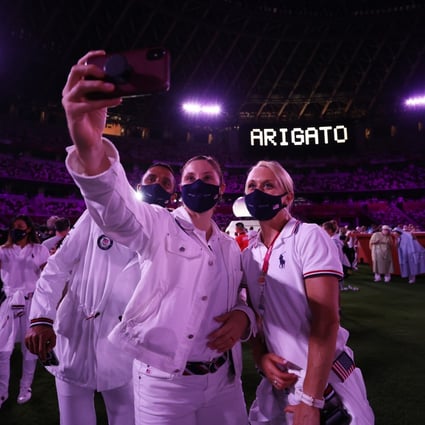 Athletes take a selfie during the closing ceremony of the Tokyo Olympics. Photo: Reuters
