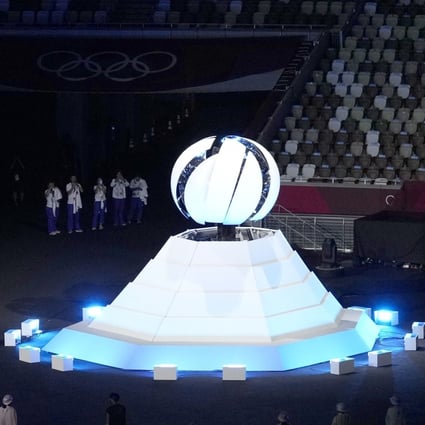 The Olympic flame being extinguished at the end of the closing ceremony of the Tokyo Olympics. Photo: Kyodo