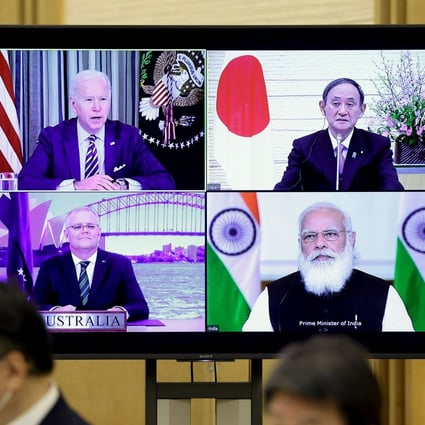 A monitor displaying the March 12 virtual Quad meeting of, clockwise from top left, US President Joe Biden, Japanese Prime Minister Yoshihide Suga, Indian Prime Minister Narendra Modi and Australian Prime Minister Scott Morrison. A follow-up meeting Thursday by senior officials of the four nations strengthened the alliance. Photo: AFP