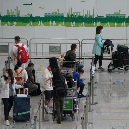 Passengers at Hong Kong International Airport before being transported to designated quarantine hotels in June. Photo: Felix Wong