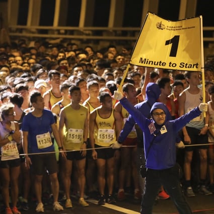Runners prepare for the start of the 10km Standard Chartered Hong Kong Marathon run in 2019. The event is now set for a return. Photo: SCMP / Felix Wong