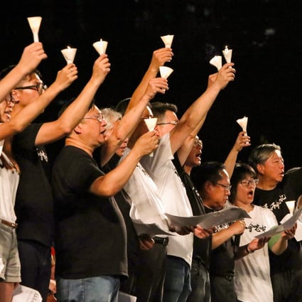 Members of the Hong Kong Alliance in Support of Patriotic Democratic Movements of China raise candles at a 2019 vigil marking the anniversary of the Tiananmen Square crackdown. Photo: Felix Wong