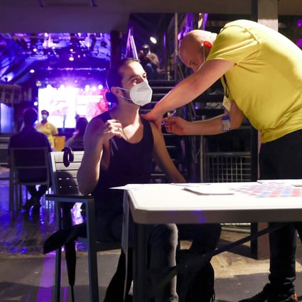 A man gets vaccinated against Covid-19 in London. Photo: Reuters