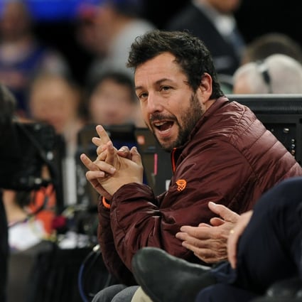 Actor Adam Sandler attends an NBA basketball game between the Boston Celtics and the New York Knicks in 2013. Photo: AP