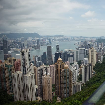 Tourists stand on the viewing platform of Victoria Peak in Hong Kong overlooking the city’s skyline. Photo: Getty Images