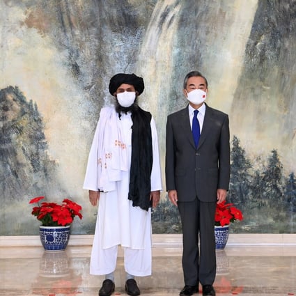 Chinese State Councillor and Foreign Minister Wang Yi with Mullah Abdul Ghani Baradar, political chief of Afghanistan's Taliban, in Tianjin, China, in July. Photo: Xinhua