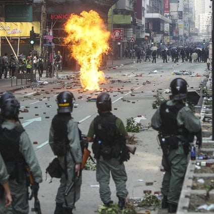 Police and protesters clash in Tsim Sha Tsui on November 18, 2019. Photo: Winson Wong