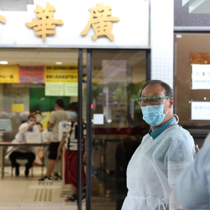 Medical workers are seen outside Kwong Wah Hospital in Yau Ma Tei. Photo: Nora Tam
