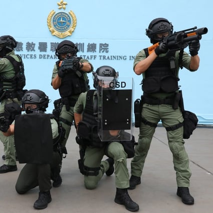 Members of the Regional Response Team display their weapons at Correctional Services Department Staff Training Institute in Stanley last year. Photo: Nora Tam