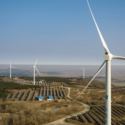 Wind turbines and solar panels near Fuxin, Liaoning province, China. Photo: Bloomberg