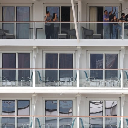 The Genting Dream cruise ship returns to Kai Tak Cruise Terminal with 1,070 passengers aboard having sailed the high seas for three days and two nights without stopping. Photo: Nora Tam