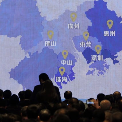 A screen shows a map of the Greater Bay Area. Bankers and investment advisers are gearing up to sell products under the Wealth Management Connect. Photo: AP Photo