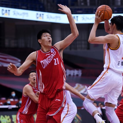 Liu Chuanxing (No 21) of the Qingdao Double Star Eagles in action against the Bayi Rockets during the 2019-2020 Chinese Basketball Association. Photo: Xinhua