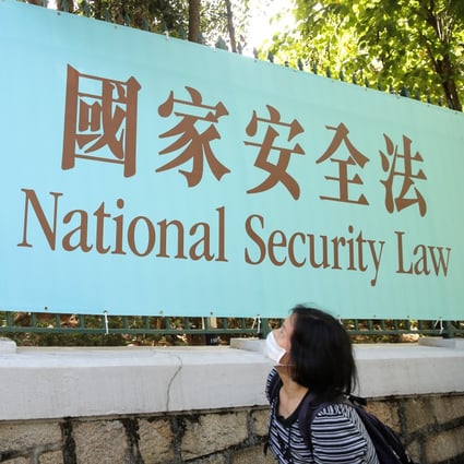 A sign in Hong Kong promotes the national security law imposed in June 2020. Photo: AP