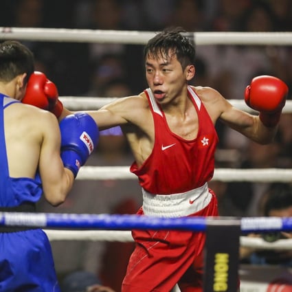 Rex Tso (red), who suffered a disappointing return to the ring after losing his first bout in 18 months to Wang Xinyan in the National Games round of 16 encounter, in action at the Southorn Stadium in Wan Chai. Photo: Winson Wong