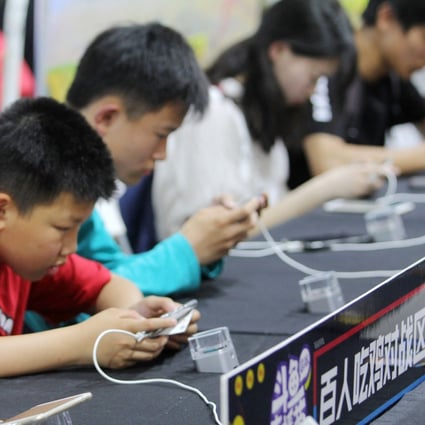 Players competing in a match of the mobile game “Honor of Kings” in the Hubei provincial capital of Wuhan on May 2018. Photo: Imaginechina