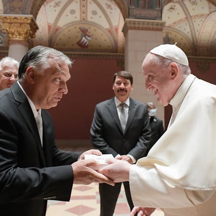 Pope Francis and Hungarian Prime Minister Viktor Orban, left, and Hungarian President Janos Ader, centre at back, in the Romanesque Hall of the Museum of Fine Arts in Budapest, Hungary on Sunday. Photo: Vatican Media / AFP
