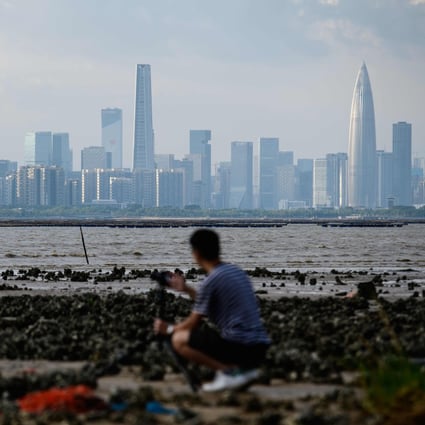 Shenzhen, as seen across Deep Bay from Hong Kong. Both cities are part of the Greater Bay Area. The zone can stay in the top 10 economies globally in the medium and longer term because of the many cross-border financial schemes linking Hong Kong and Macau with mainland China, says a partner at Deloitte. Photo: AFP