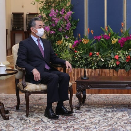 Chinese Foreign Minister Wang Yi meets Singapore’s Prime Minister Lee Hsien Loong at the Istana, or Presidential Palace, in Singapore. Photo: EPA