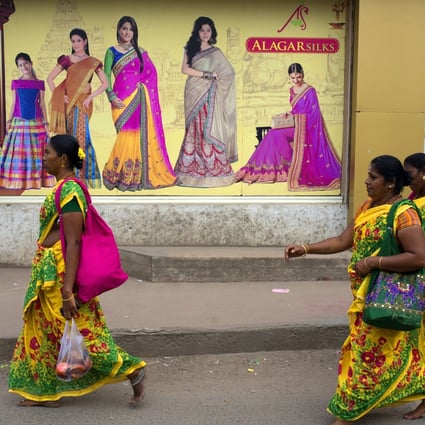 Women in saris in Tamil Nadu, which has just granted workers the right to sit. Photo: Getty Images