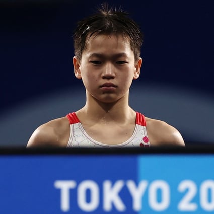 Quan Hongchan of China looks on from the platform ahead of her 10m platform dive at the Tokyo 2020 Olympic Games. Photo: Reuters